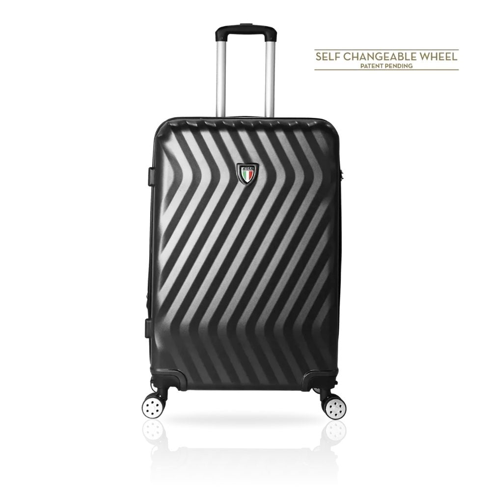 A black and gray hardshell spinner suitcase with a diagonal striped pattern, featuring an extended telescopic handle and four wheels. The Italian flag shield logo is visible on the front.